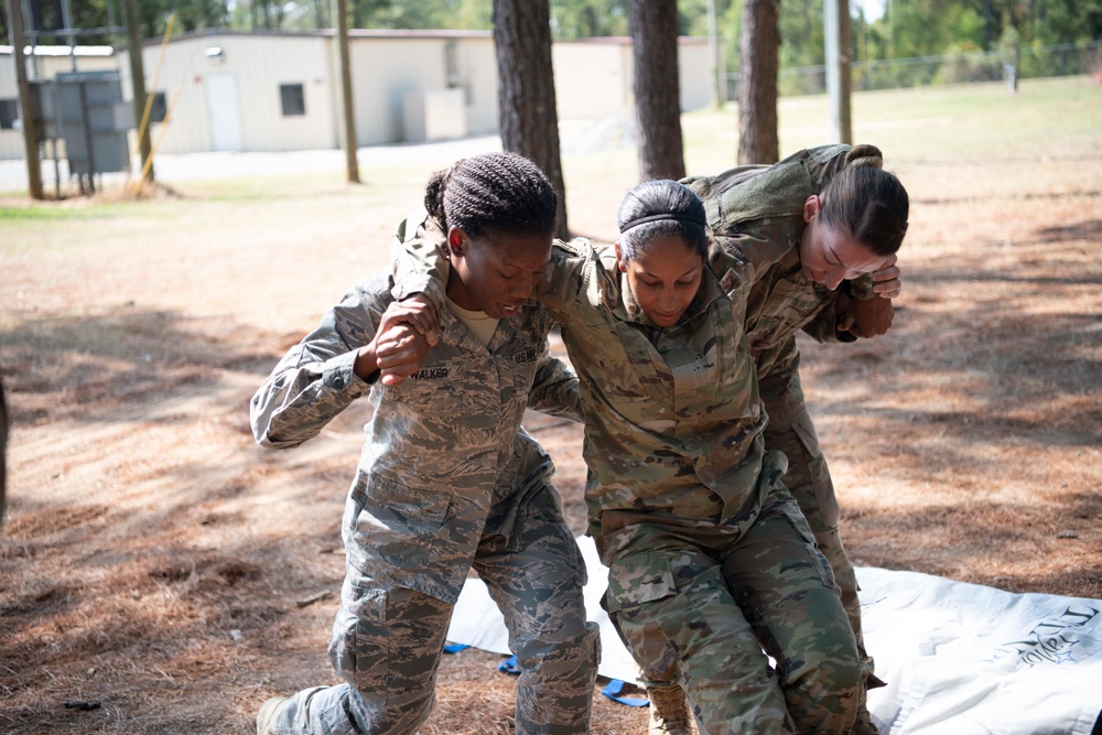 &quot;Godzilla Class&quot; trainees evacuate wounded during a mock combat scenario.