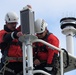U.S. Coast Guard Petty Officers install Aids to Navigation Light