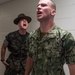 190926-N-TE695-0004 NEWPORT, R.I. (Sept. 26, 2019) -- Marine Corps Drill Instructors induces stress on Navy OCS student