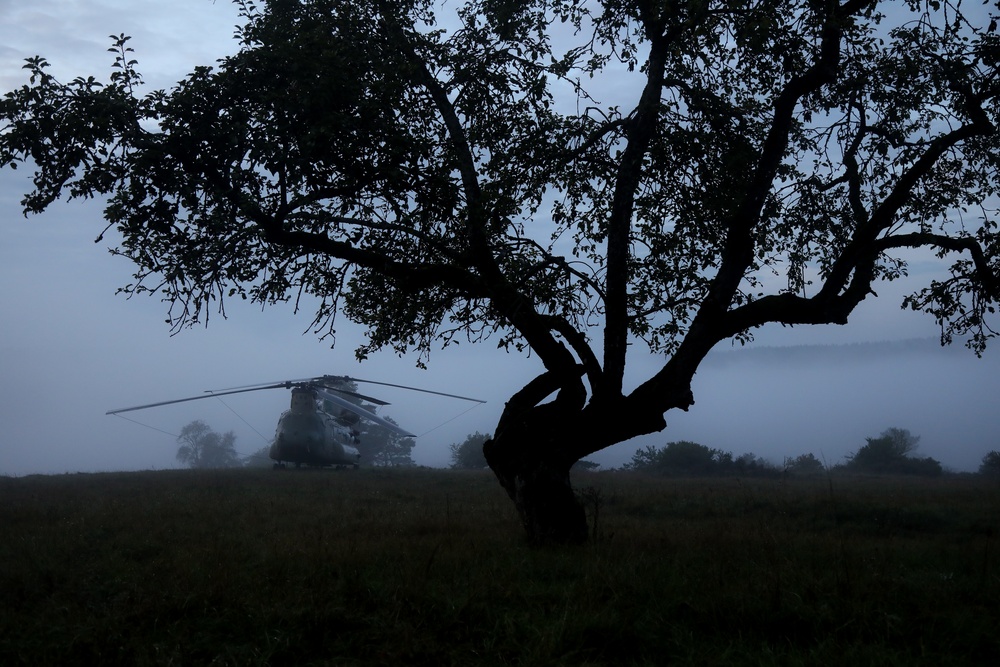 A U.S. Army CH-47 Chinook is staged on a landing Zone during Saber Junction 19