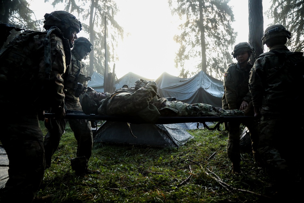 U.S. Soldiers litter carry a casualty during Saber Junction 19