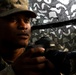 U.S. Army Cpl. Tomarius Roberts prepares to take a photo during Saber Junction 19