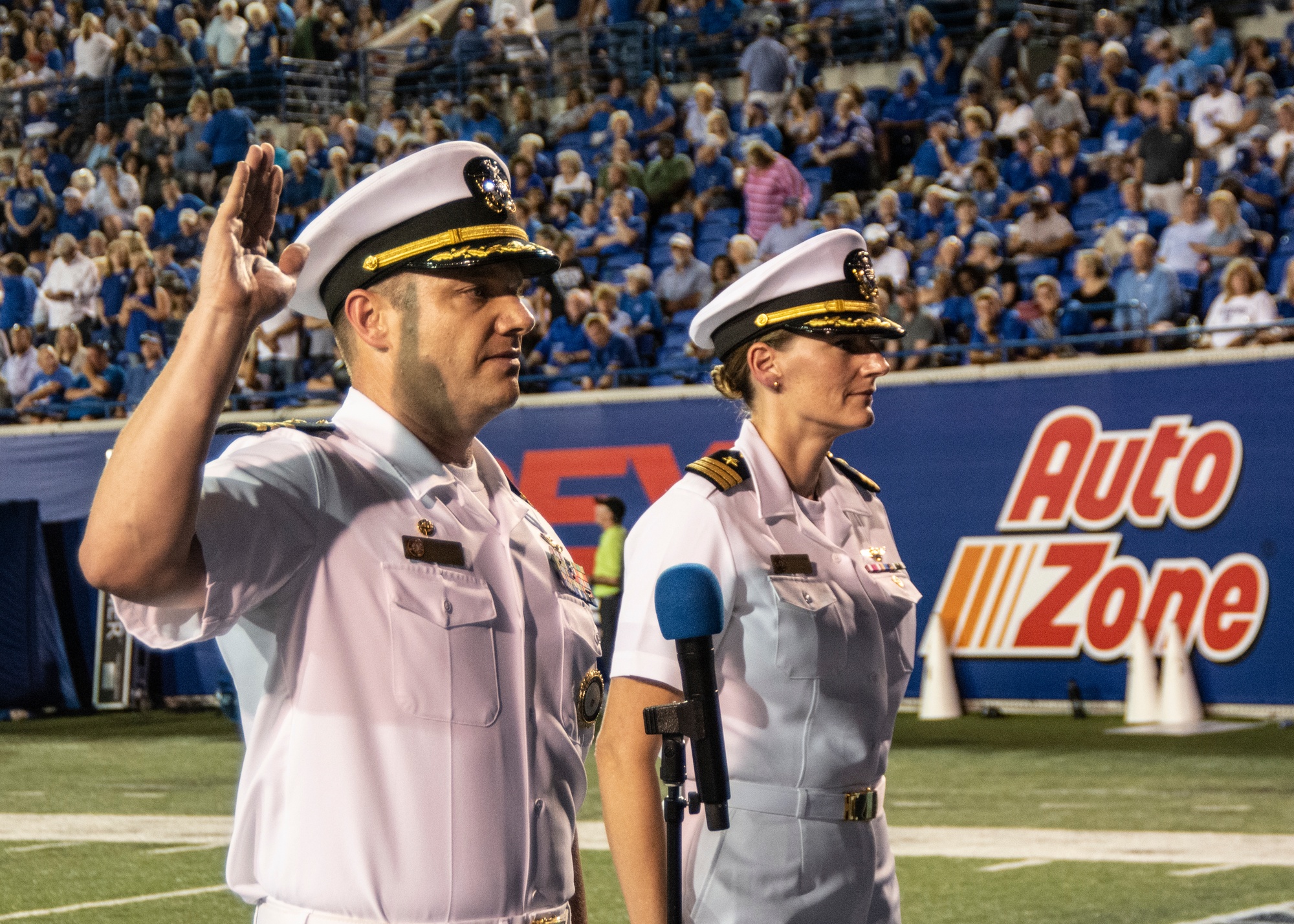 U.S. Military recruits are sworn in during halftime on Salute to