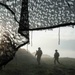 U.S. Soldiers patrol through their camp during Saber Junction 19