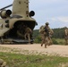 U.S. Soldiers dismount from a CH-47 Chinook helicopter during Saber Junction 19