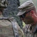 An Observer Coach Trainer interacts with a soldier during Saber Junction 19