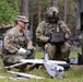 An Observer Coach Trainer interacts with a soldier during Saber Junction 19