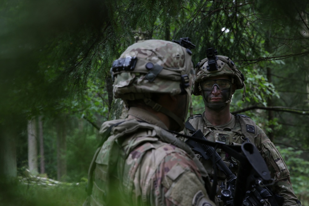 U.S. Soldiers exchange information during Saber Junction 19
