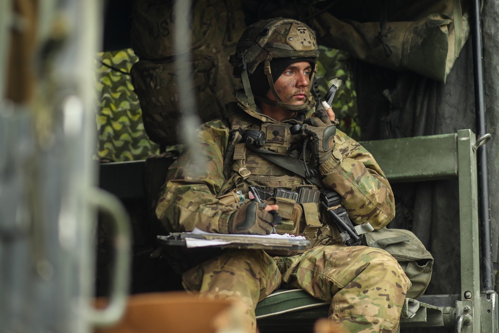 U.S. Army Spc. Michael Adams receives an order for a fire mission during Saber Junction 19