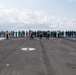 U.S. Sailors participate in a foreign-object-debris walkdown on the flight deck of the aircraft carrier USS John C. Stennis