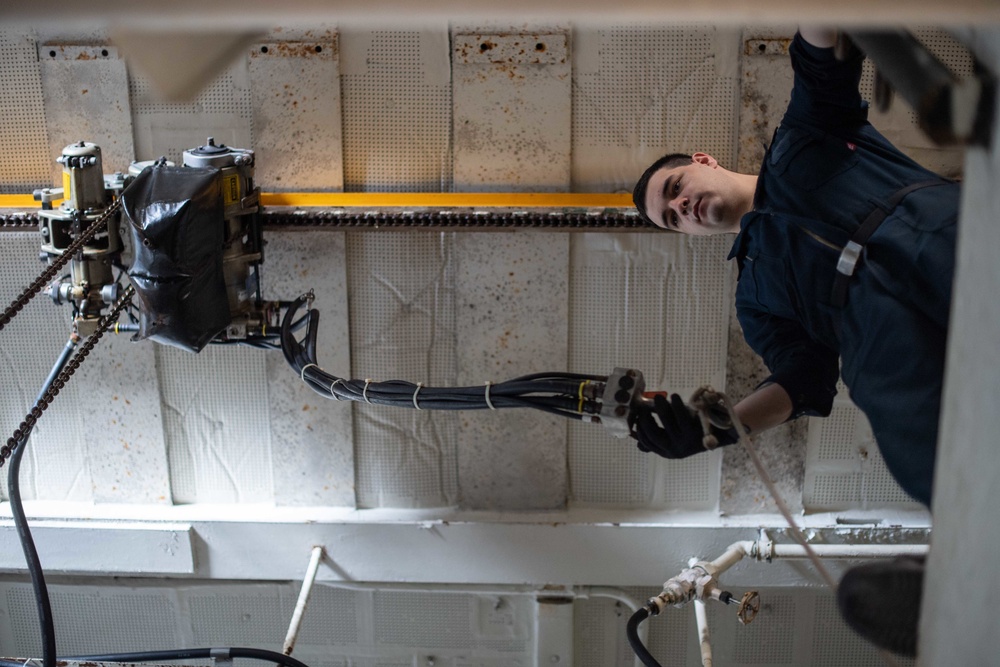 U.S. Sailor operates a hoist