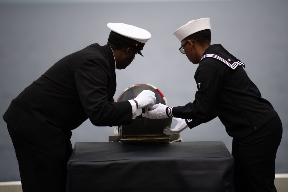 U.S. Sailors conduct a burial at sea aboard the aircraft carrier USS John C. Stennis (CVN 74)