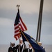U.S. Sailors stand at attention during a burial at sea