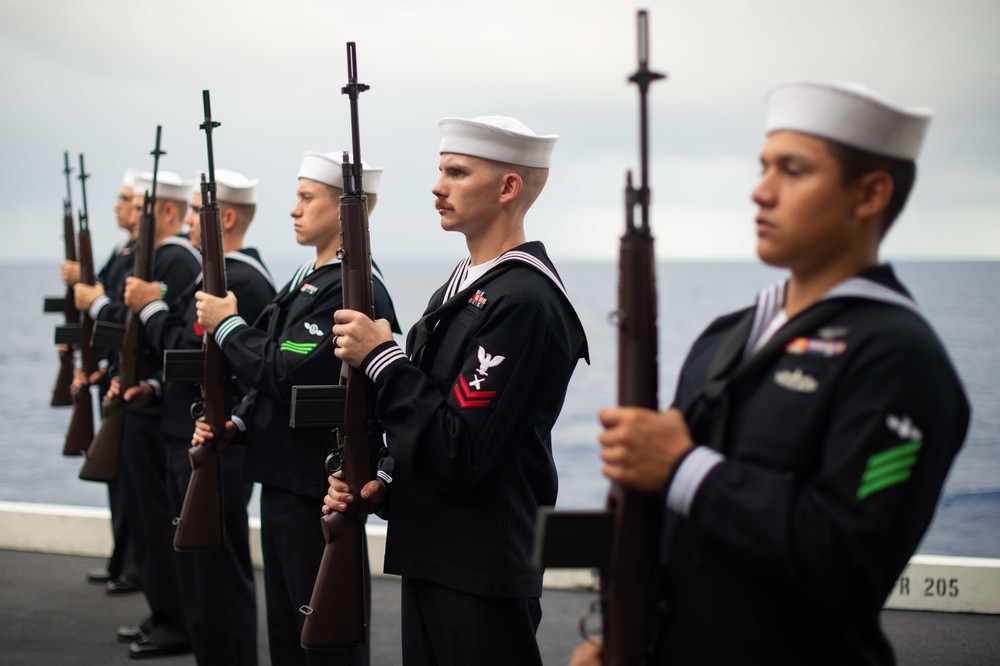 Sailors participate in a burial-at-sea