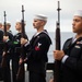 Sailors participate in a burial-at-sea