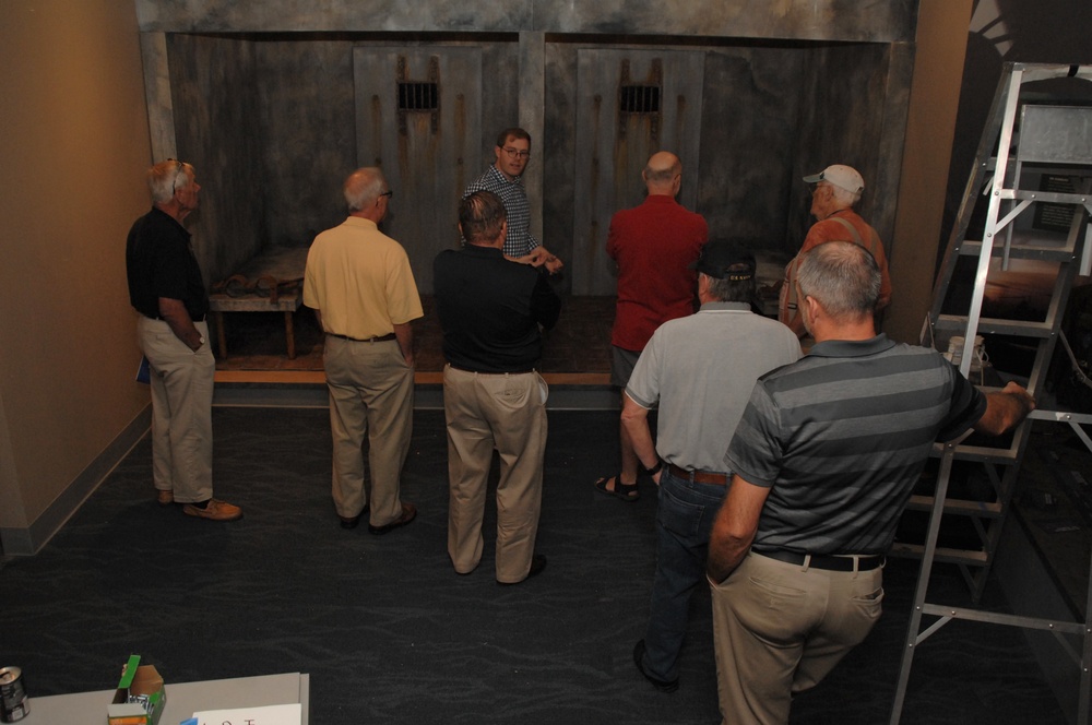 Museum volunteers tour new exhibit at Naval Museum