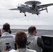 U.S. Sailors observe flight operations from the landing signal officer platform