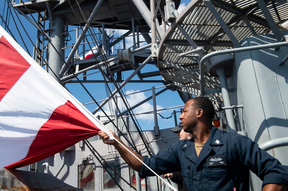 USS San Jacinto Sailor Lowers National Ensign