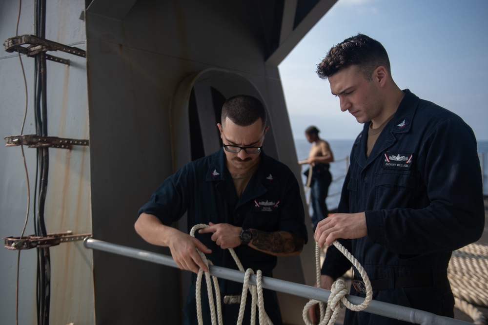 U.S. Navy Boatswain’s Mate 3rd Class Michael Castaneda, from Salt Lake City, left, and Boatswain’s Mate 3rd Class Zachary Williams, from Boone, North Carolina, prepare mooring lines on the fantail