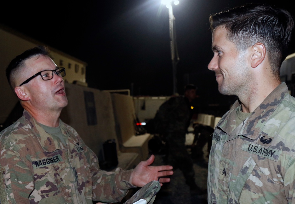 Son visits father in Kuwait on the way home from Iraq