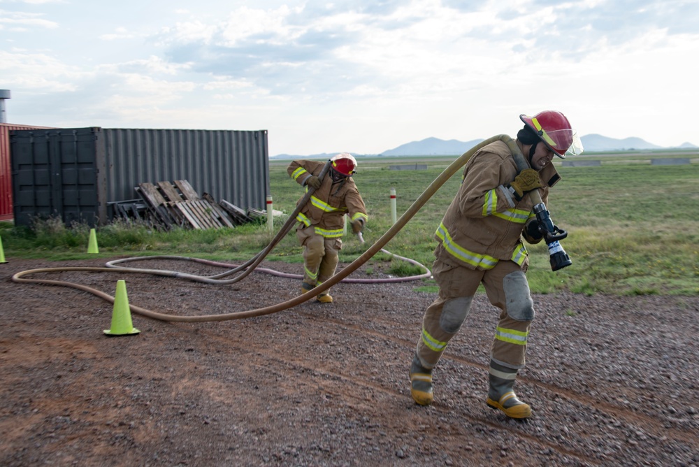 Commanders, 1st Sgt. Compete in firefighter challenge