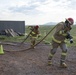 Commanders, 1st Sgt. Compete in firefighter challenge