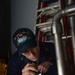 U.S. Navy Sailor performs maintenance