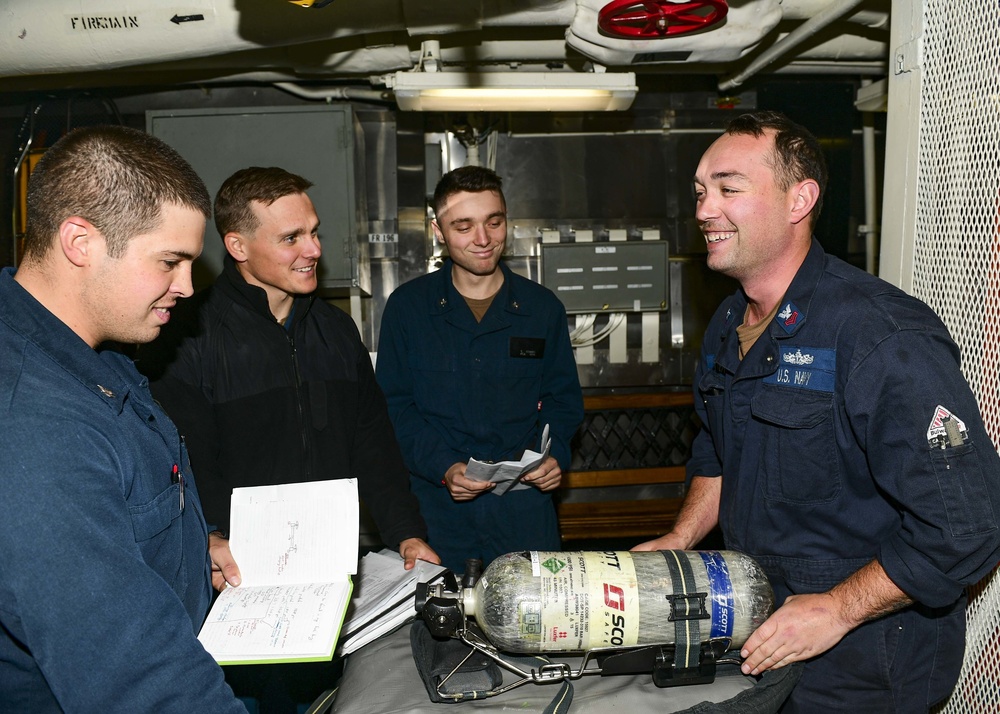 USS Normandy Sailor Gives Self-Contained Breathing Apparatus Training