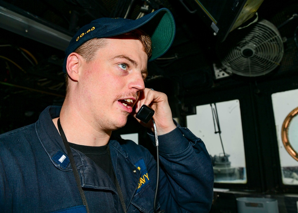 USS Normandy Sailor Stands Officer Of The Deck Watch