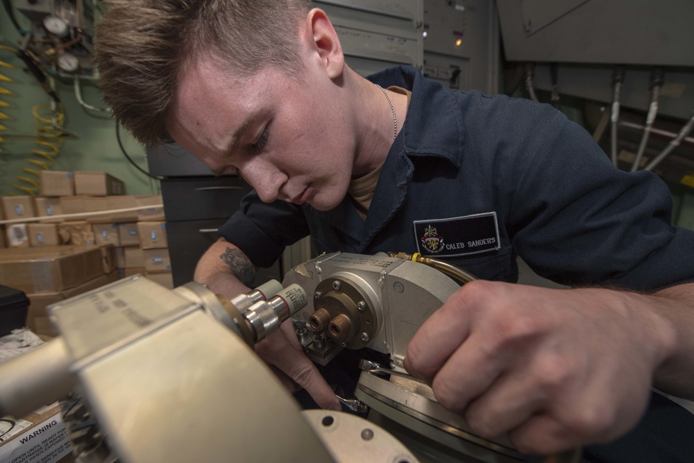 USS Antietam (CG 54) Sailor performs maintenance on a cross-field amplifier