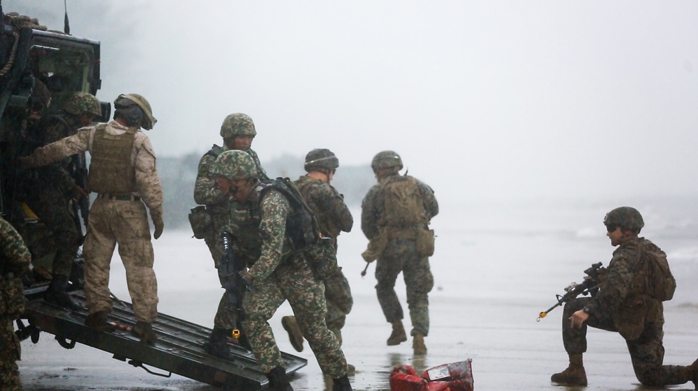 U.S. Marines, Sailors with 3rd Marine Division and the MAF conduct an amphibious assault