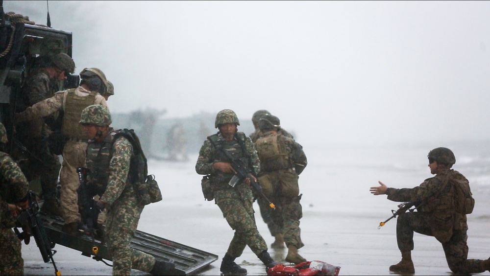 U.S. Marines, Sailors with 3rd Marine Division and the MAF conduct an amphibious assault