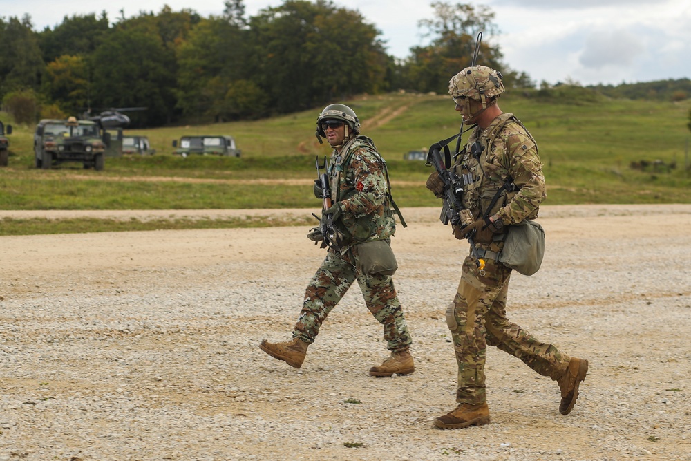 A U.S. Soldier patrols with a North Macedonia soldier during Saber Junction 19