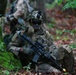 A U.S. Soldier rests against a tree after a patrol during Saber Junction 19