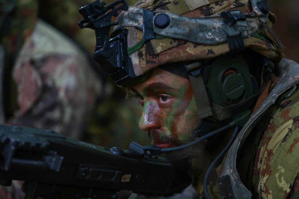 An Italian soldier provides security during Saber Junction 19