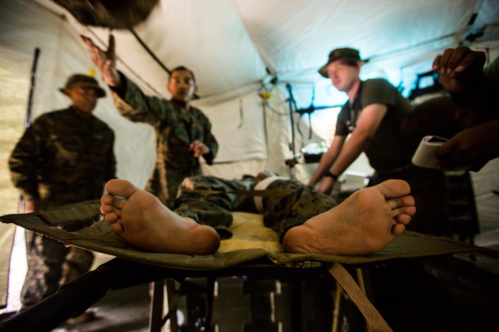 U.S. Marines, Sailors with 3rd Marine Division and the MAF participate in a Simulated Casualty Evacuation Drill