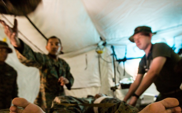 U.S. Marines, Sailors with 3rd Marine Division and the MAF participate in a Simulated Casualty Evacuation Drill