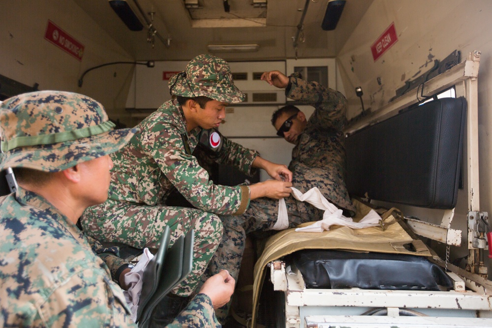 U.S. Marines, Sailors with 3rd Marine Division and the MAF participate in a Simulated Casualty Evacuation Drill