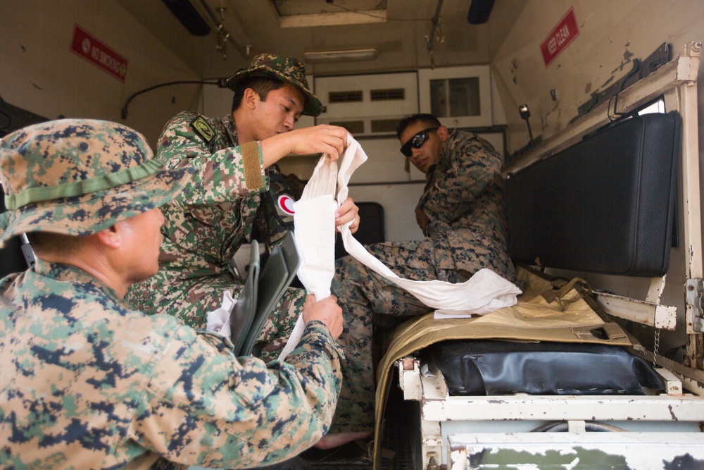 U.S. Marines, Sailors with 3rd Marine Division and the MAF participate in a Simulated Casualty Evacuation Drill