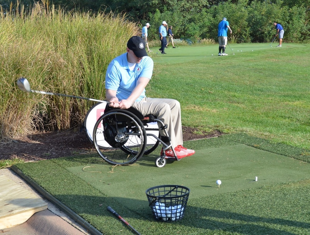 Paralyzed Vet Warms Up on Driving Range