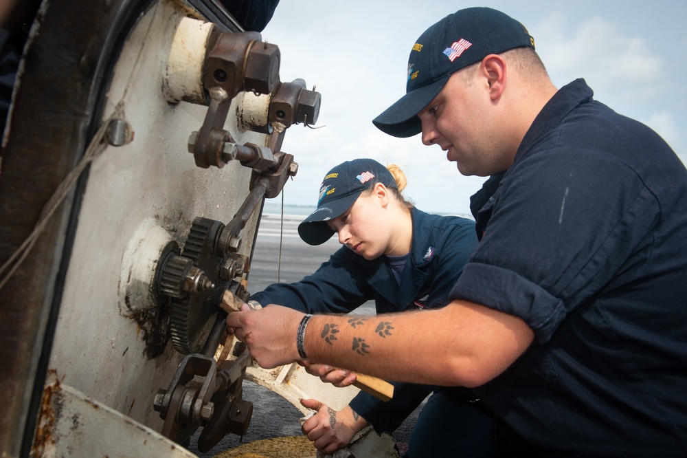 U.S. Sailors conduct maintenance