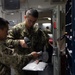 U.S. Sailors disperses mail in the post office
