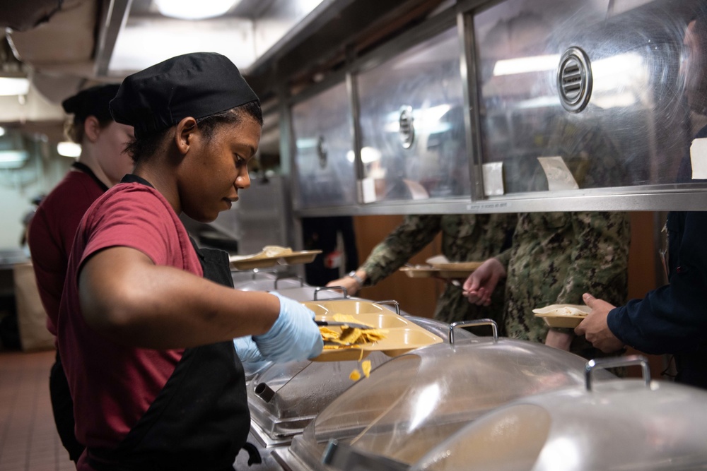 U.S. Sailor serves food