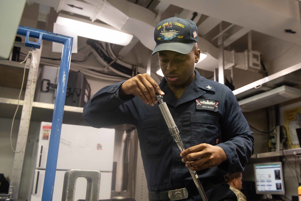 U.S. Sailor calibrates a torch wrench