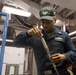 U.S. Sailor calibrates a torch wrench