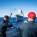 USS Gridley Sailors Fire a Shot Line to HNoMS Thor Heyerdahl