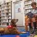 Dog visits Wiesbaden Library for PaWs read-aloud program