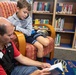 Dog visits Wiesbaden Library for PaWs read-aloud program