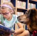 Dog visits Wiesbaden Library for PaWs read-aloud program