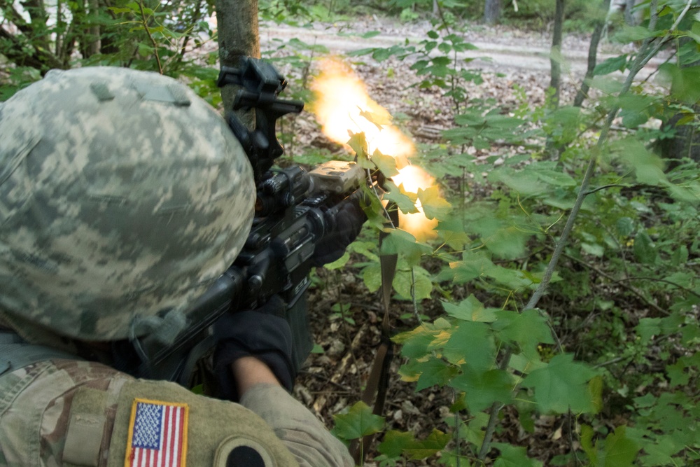 Soldiers of 1-148th Infantry Regiment tackle combat during annual training